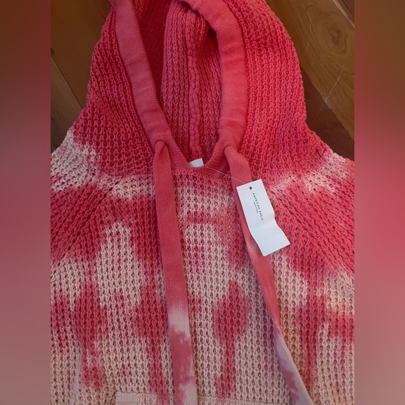 A cropped hooded sweater, new with tags on it. Comfy and cute! - Picture 3 of 3